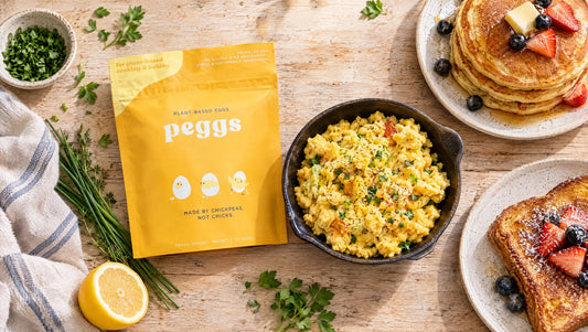 The real Peggs pouch beside a breakfast spread of scrambled Peggs, pancakes, and French toast